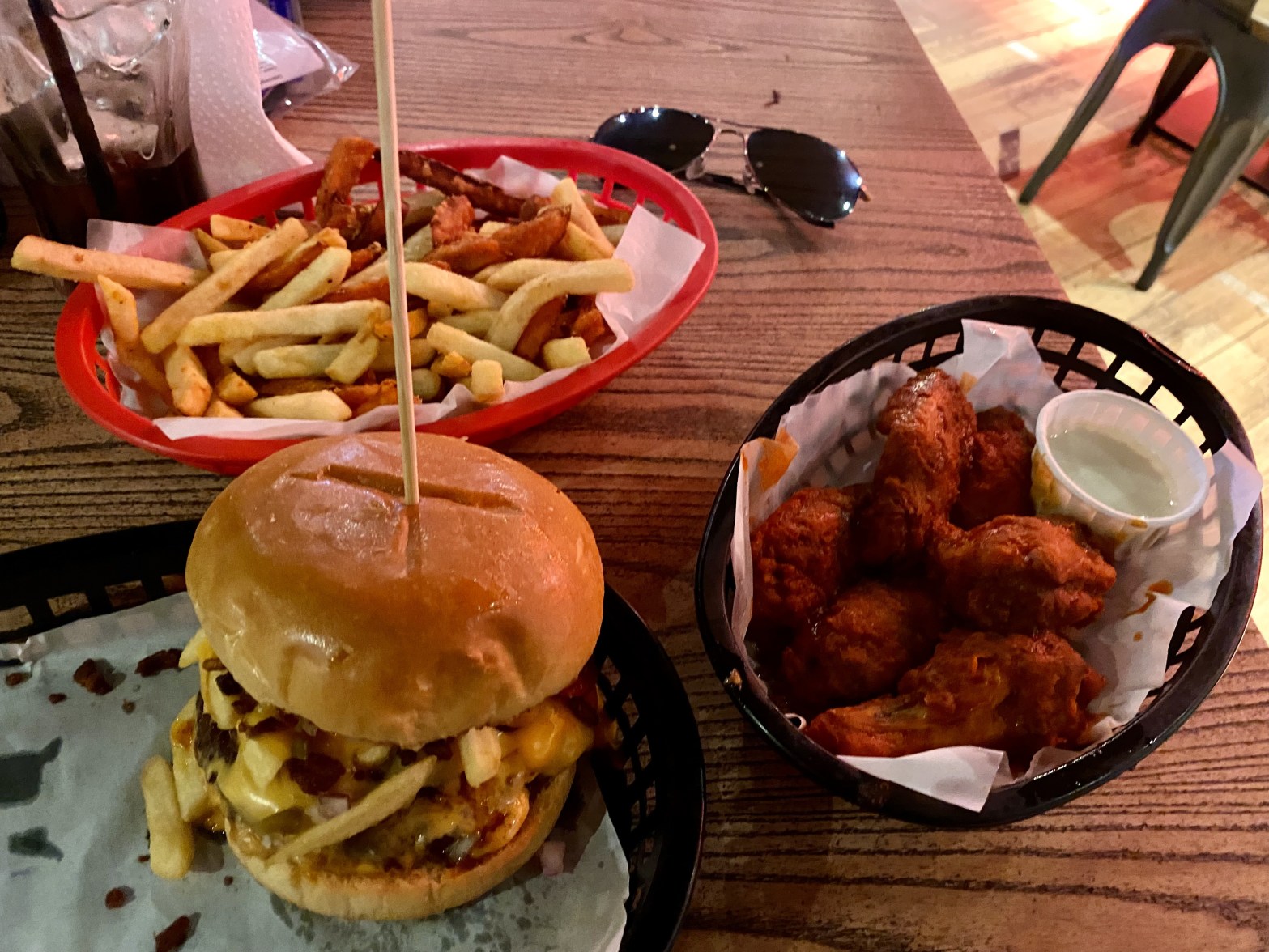 Almost Famous burger hot wings and fries